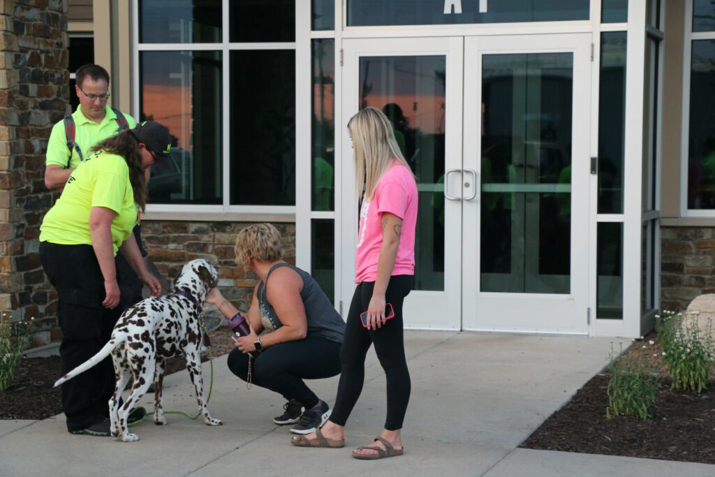 Randy and Jessy watch as Tucker says hello to Abby and Trinity from Buist Electric.