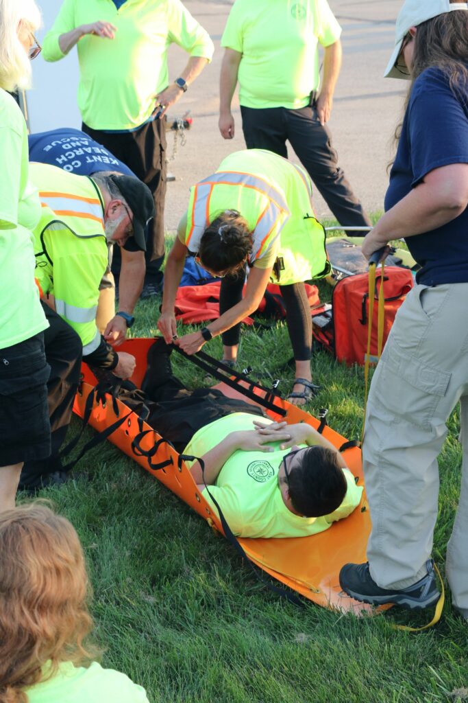 The patient must be secured to the Sked before being moved.