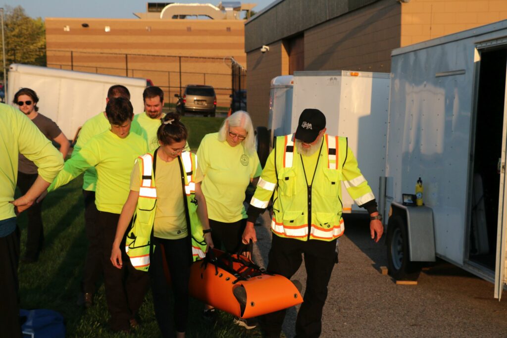 Carrying the patient in a secure manner.