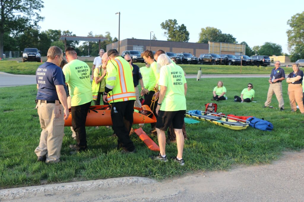 Securely passing the patient over an obstacle.