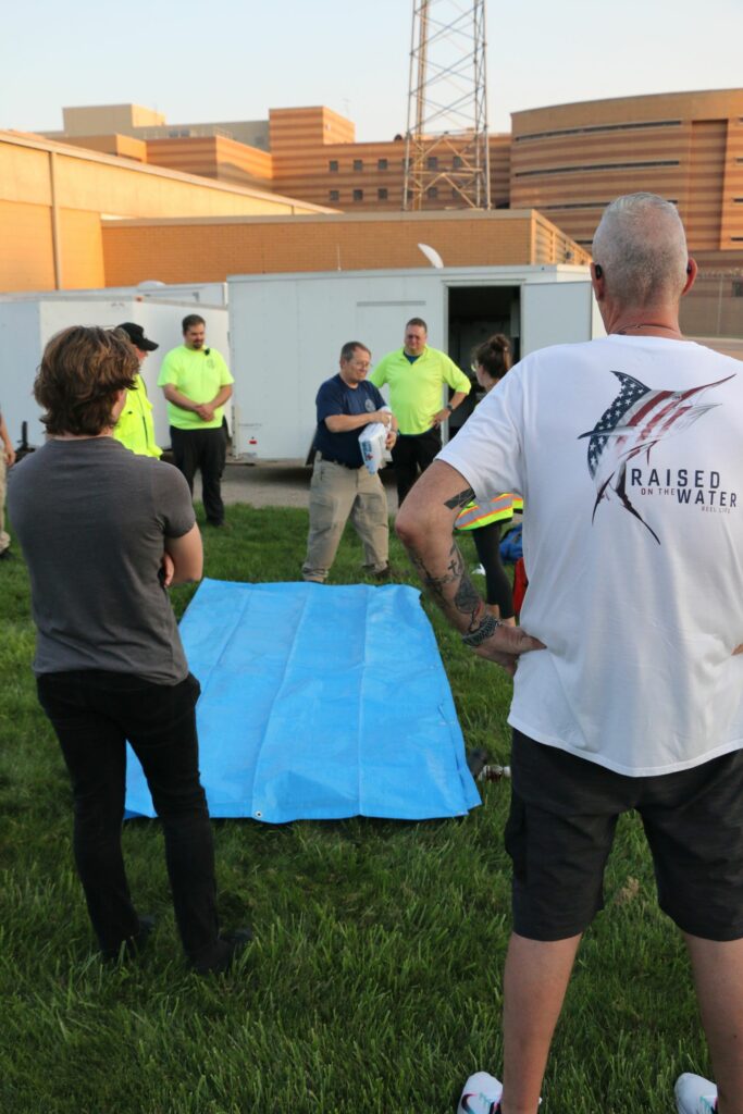 Demonstrating a technique for transporting a hypothermic patient.