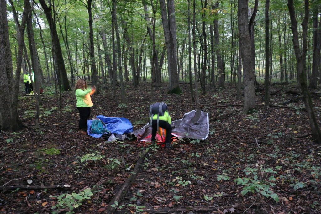 Getting started on building a temporary shelter.