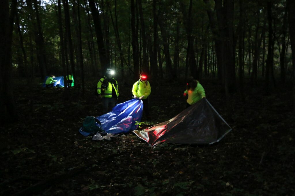 Teams working on their shelters.